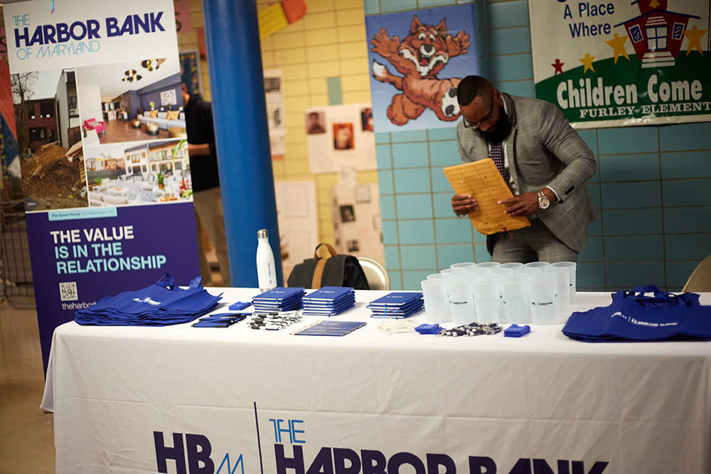 A table of Harbor Bank swag